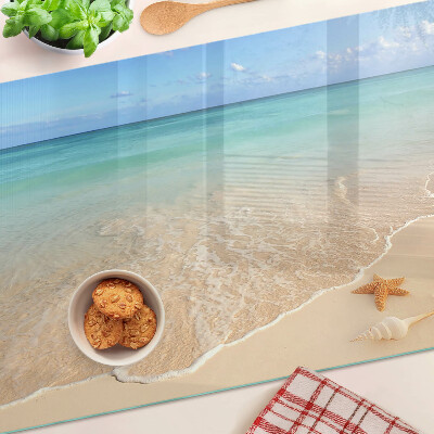 Üveg vágódeszka fényképpel Strand kagylókkal és hullámokkal