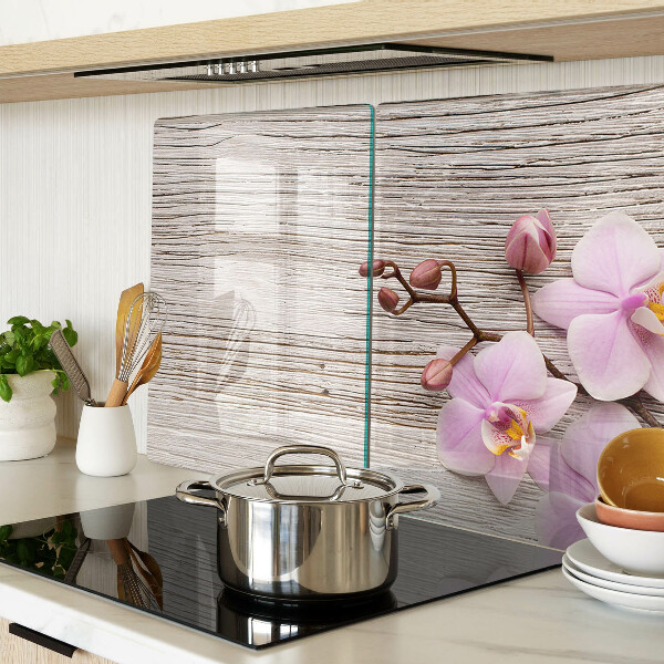 Üveg vágódeszka fényképpel Orchideák fa háttéren