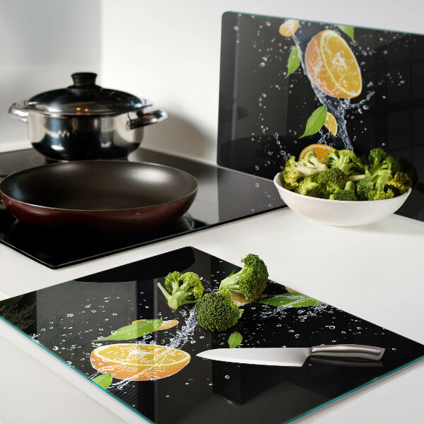 Üveg vágódeszka fényképpel Citrusfélék vízben