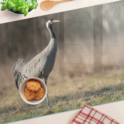 Üveg vágódeszka Egy daru a táj hátterében