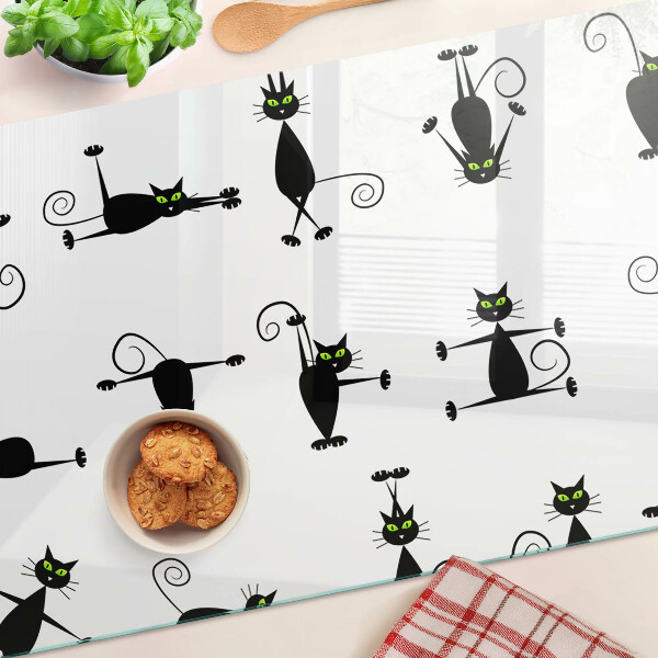 Üveg vágódeszka Fekete macskák zöld szemekkel