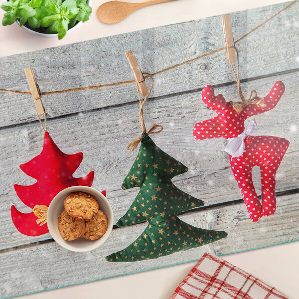 Üveg vágódeszka fényképpel Karácsonyi díszek fa háttéren
