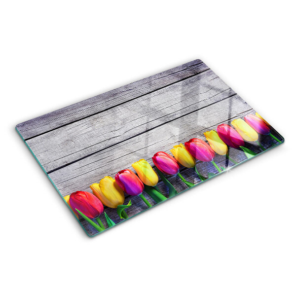 Üveg vágódeszka Tulipánok fa háttéren