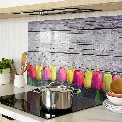 Üveg vágódeszka Tulipánok fa háttéren