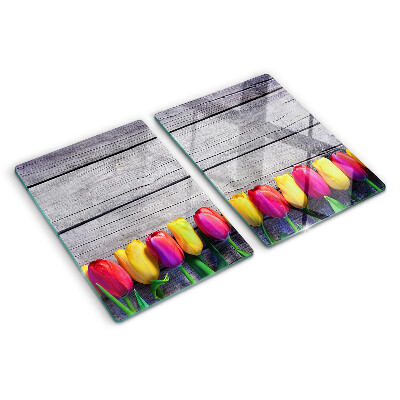 Üveg vágódeszka Tulipánok fa háttéren
