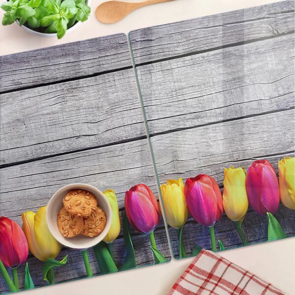 Üveg vágódeszka Tulipánok fa háttéren