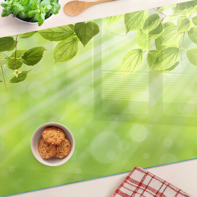 Üveg vágódeszka Zöld levelek a fénnyel szemben