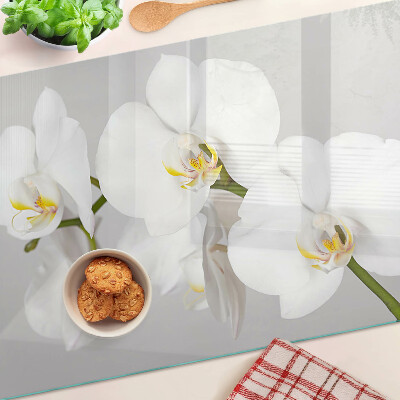 Üveg vágódeszka fényképpel Orchideák tükörkép háttér előtt