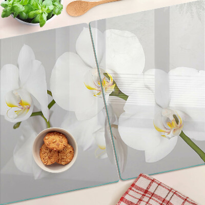 Üveg vágódeszka fényképpel Orchideák tükörkép háttér előtt
