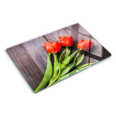 Üveg vágódeszka Tulipánok fa háttéren