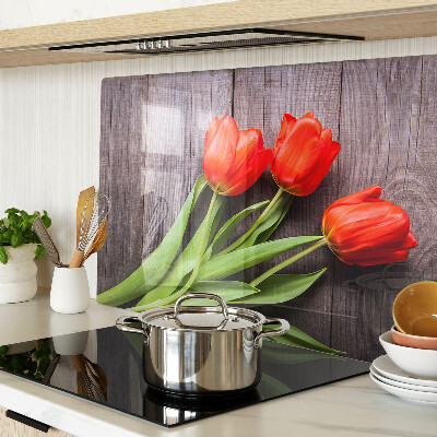 Üveg vágódeszka Tulipánok fa háttéren