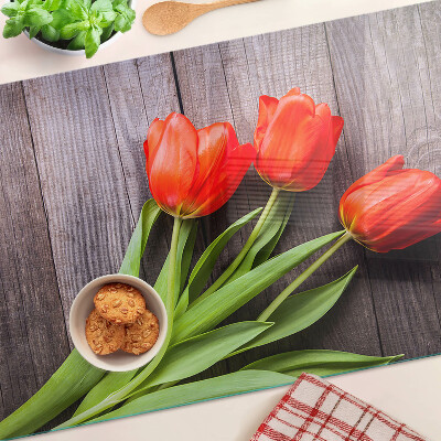 Üveg vágódeszka Tulipánok fa háttéren