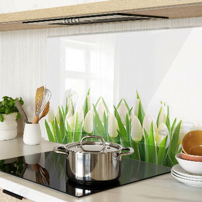 Üveg vágódeszka fényképpel Tulipánok a zöld fűben