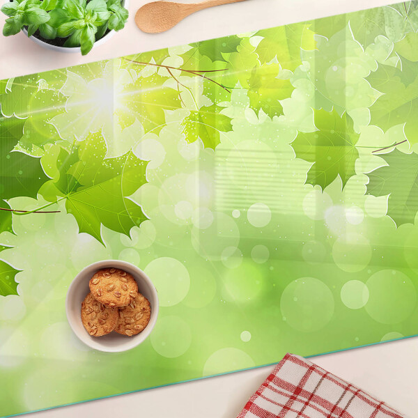Üveg vágódeszka Levelek a nap sugaraiban