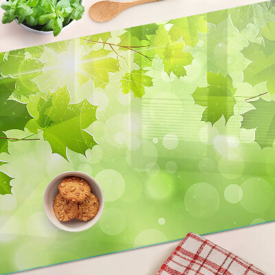 Üveg vágódeszka Levelek a nap sugaraiban