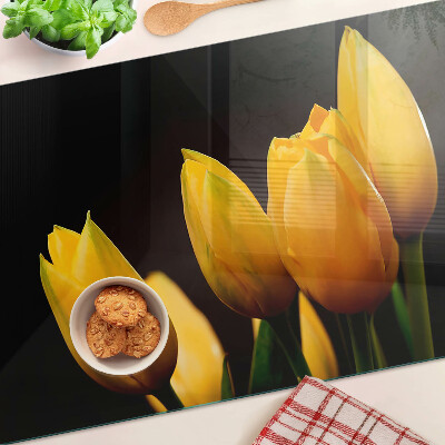 Üveg vágódeszka fényképpel Sárga tulipánok fekete alapon