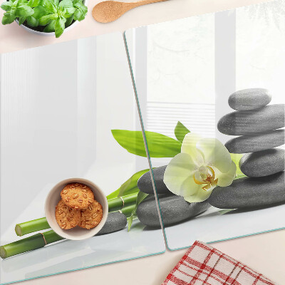 Üveg vágódeszka fényképpel Orchidea és spa kövek