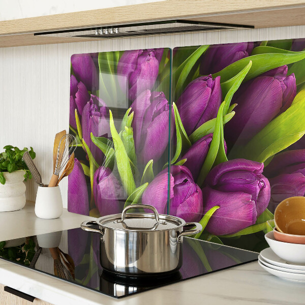 Üveg vágódeszka fényképpel Lila tulipánok zöld levelekkel