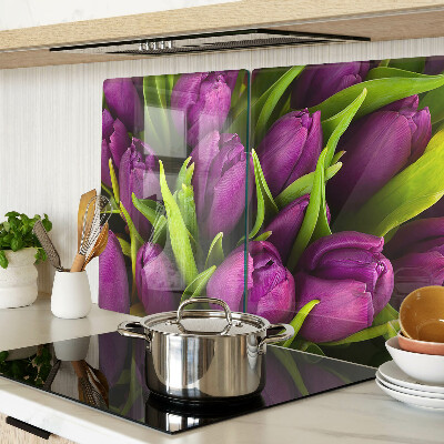 Üveg vágódeszka fényképpel Lila tulipánok zöld levelekkel