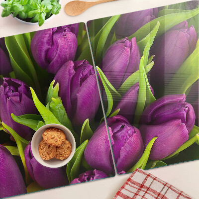 Üveg vágódeszka fényképpel Lila tulipánok zöld levelekkel