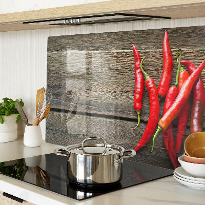 Üveg vágódeszka Chili paprika fa háttéren