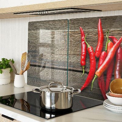 Üveg vágódeszka Chili paprika fa háttéren