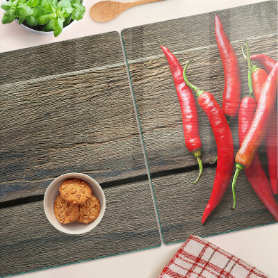 Üveg vágódeszka Chili paprika fa háttéren
