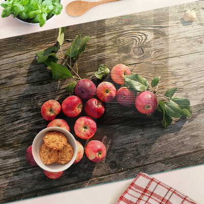 Edzett üveg vágódeszka Almák fa háttéren