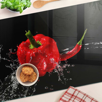 Üveg vágódeszka fényképpel Pirospaprika vízben