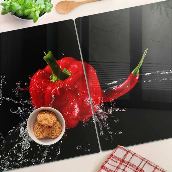 Üveg vágódeszka fényképpel Pirospaprika vízben
