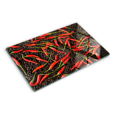 Üveg vágódeszka fényképpel Chili paprika fekete borssal