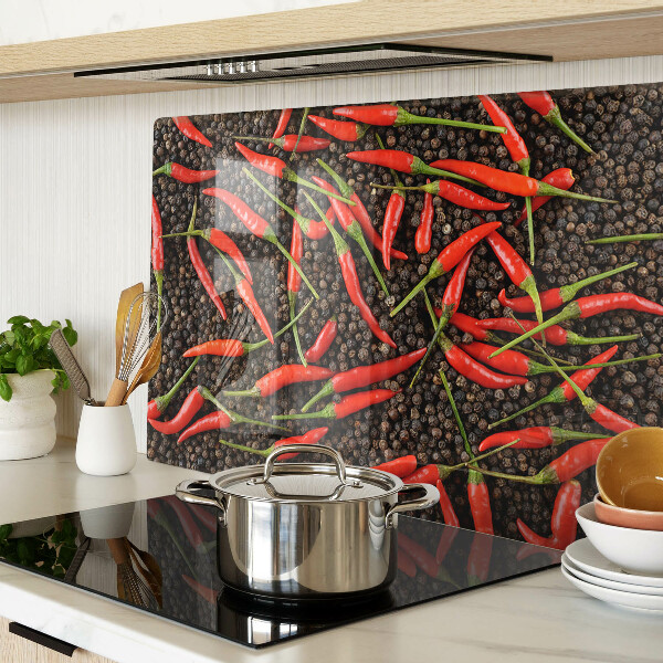 Üveg vágódeszka fényképpel Chili paprika fekete borssal