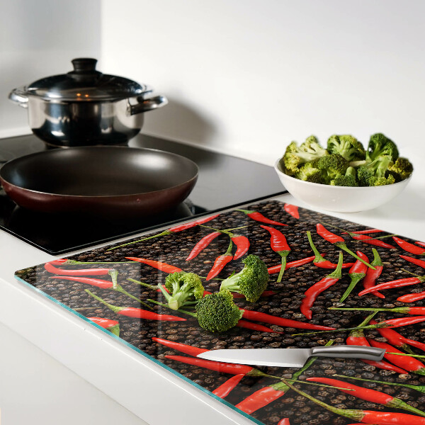 Üveg vágódeszka fényképpel Chili paprika fekete borssal
