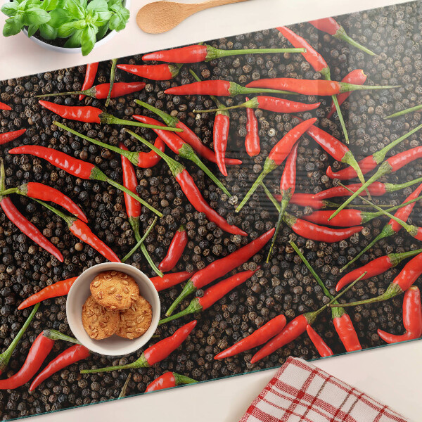 Üveg vágódeszka fényképpel Chili paprika fekete borssal