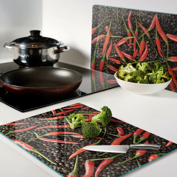 Üveg vágódeszka fényképpel Chili paprika fekete borssal
