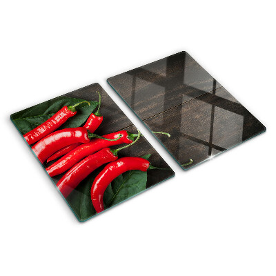 Edzett üveg vágódeszka Chili paprika fa háttéren