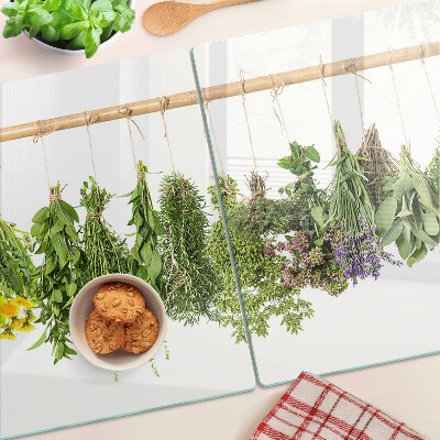 Üveg vágódeszka fényképpel Szárított gyógynövények egy madzagon