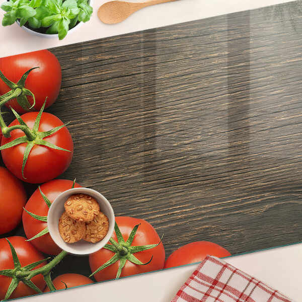 Üveg vágódeszka fényképpel Paradicsom fa háttéren