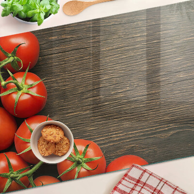 Üveg vágódeszka fényképpel Paradicsom fa háttéren