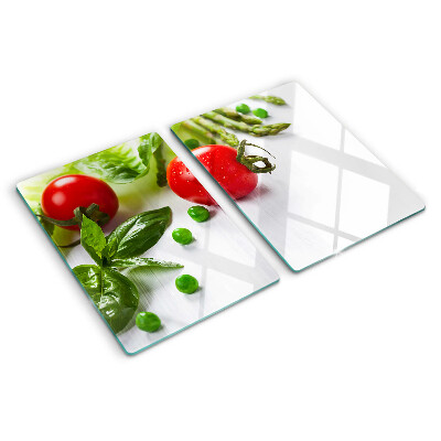 Üveg vágódeszka fényképpel Zöldségek egy fehér konyhapulton