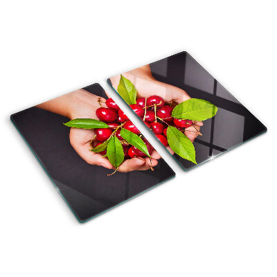 Üveg vágódeszka Piros cseresznye a kezében