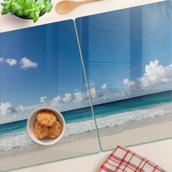 Üveg vágódeszka fényképpel Egy türkizkék vízzel és felhőkkel teli strand