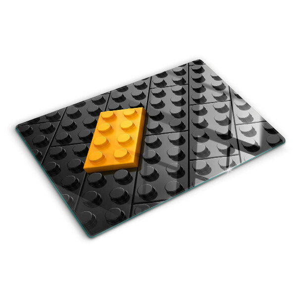 Edzett üveg vágódeszka LEGO kockák fekete háttéren