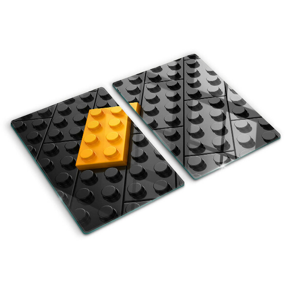 Edzett üveg vágódeszka LEGO kockák fekete háttéren