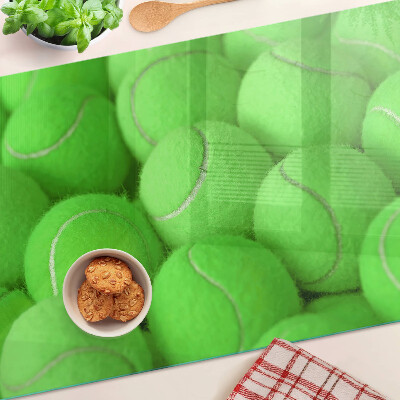 Üveg vágódeszka fényképpel Teniszlabdák zöld háttérrel
