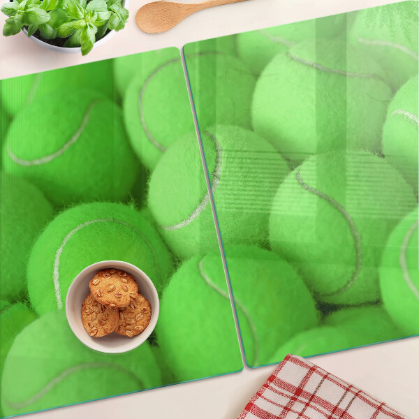 Üveg vágódeszka fényképpel Teniszlabdák zöld háttérrel