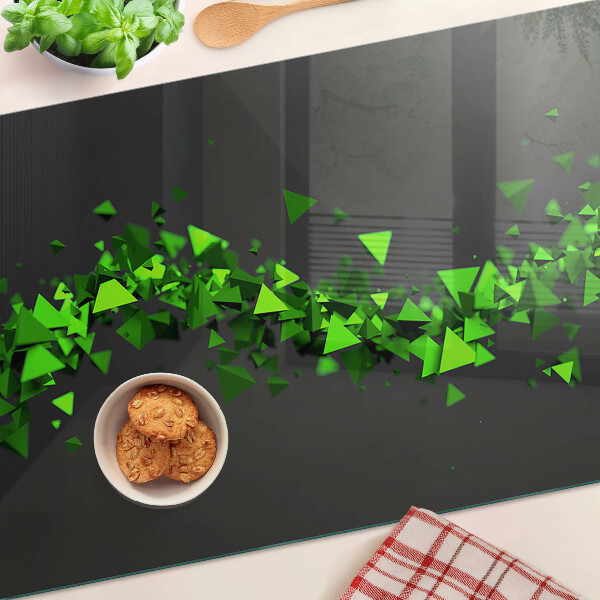 Üveg vágódeszka fényképpel Zöld háromszögek fekete háttéren