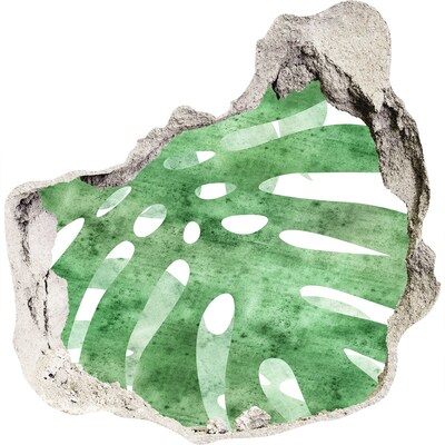 Fali matrica lyuk a falban Zöld levél egy sérült falon