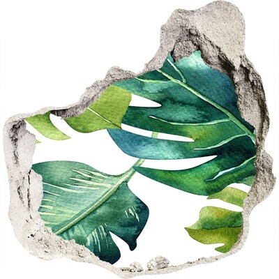 Fali matrica lyuk a falban Zöld trópusi levelek egy sérült falban