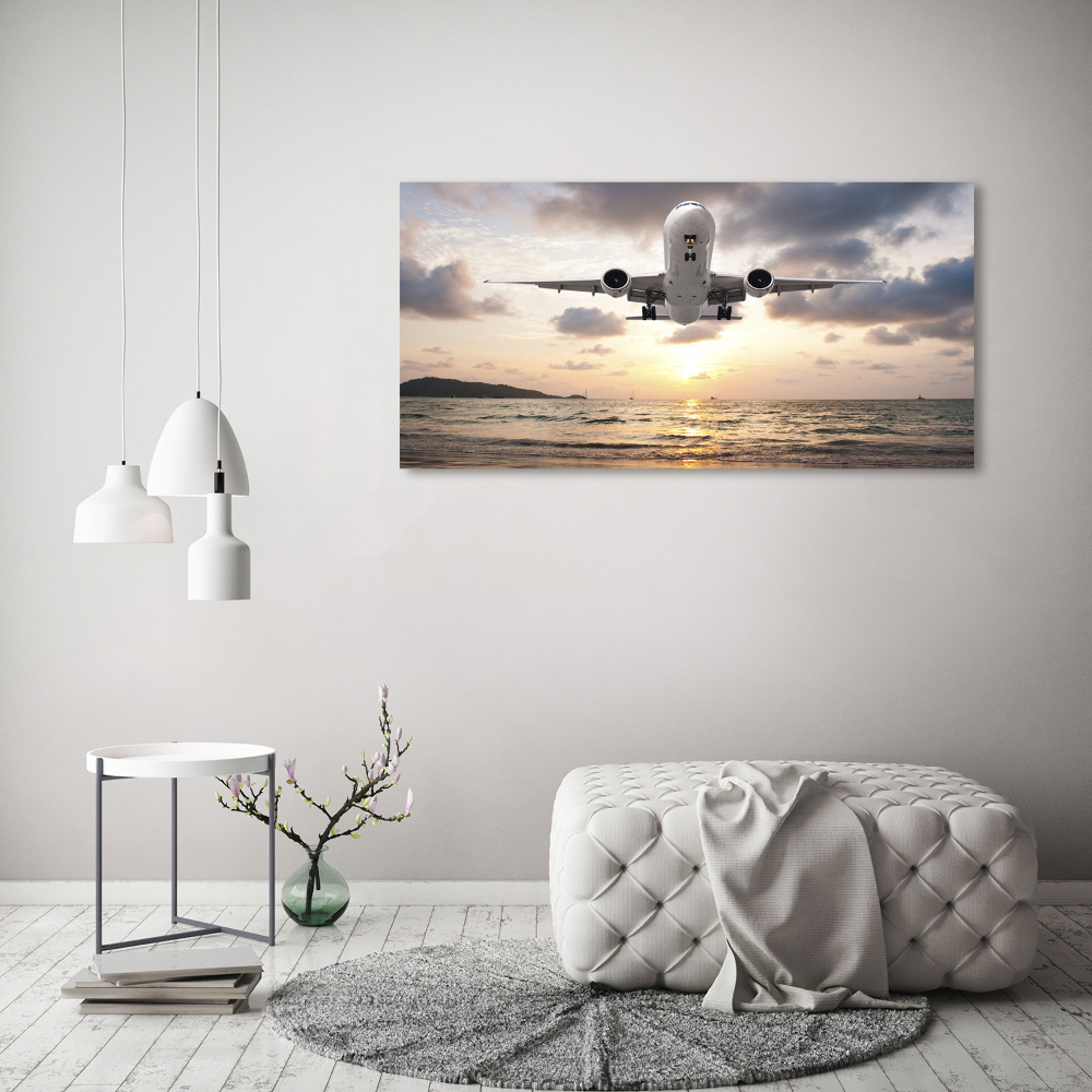 Vászonkép falra Repülőgép a tenger felett